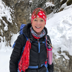 lorna is hiking on a snowy mountain.